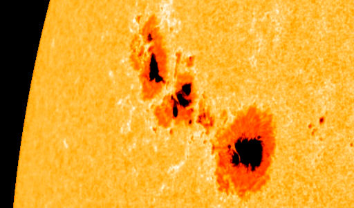 Photo of the Sun with several sunspots visible