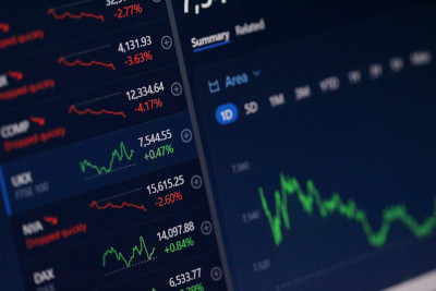Image showing stock market graphs and data. Photo by Anne Nygård on Unsplash.